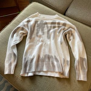 Grey and white sweater.